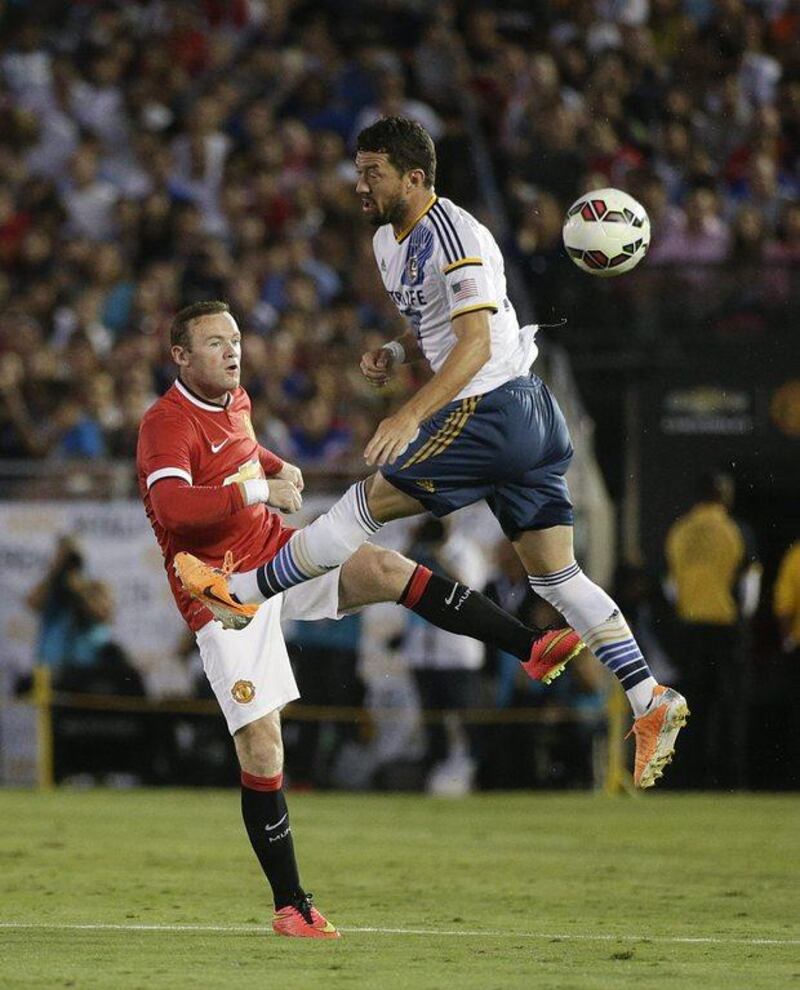 Wayne Rooney of Manchester United kicks the ball past LA Galaxy's Dan Gargan during their international friendly on Wednesday night at the Rose Bowl in Pasadena, California. AP Photo