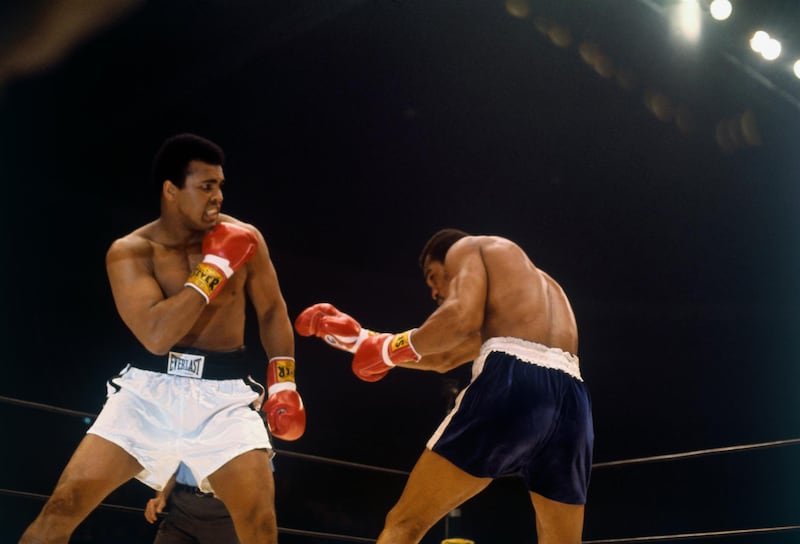 (Original Caption) Action of boxer Muhammed Ali throwing punch at Ken Norton as he ducks during bout.