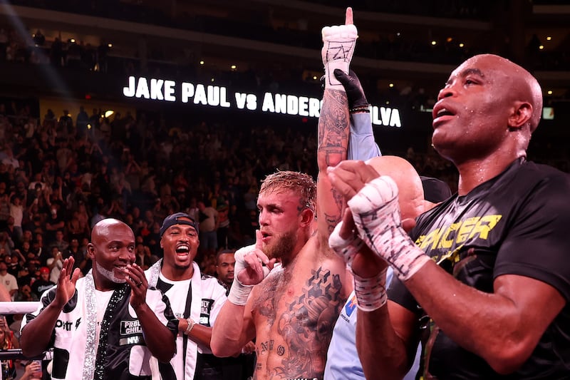 Jake Paul has his arm raised in victory after his unanimous decision win over Anderson Silva. AFP