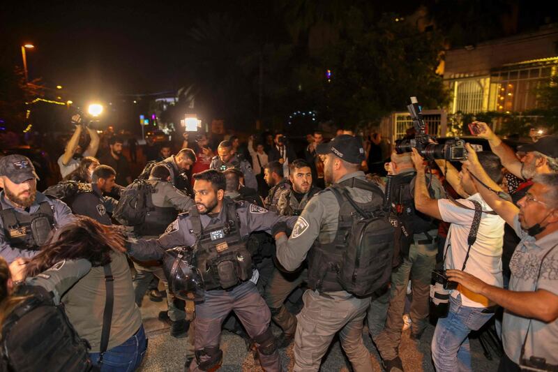 Israeli security forces detain a Palestinian during protests in the Sheikh Jarrah neighbourhood of East Jerusalem. AFP