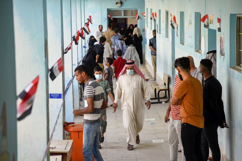 A man walks through a polling station in Nassiriya, Iraq, on the day of the country’s parliamentary election. Photo: Reuters