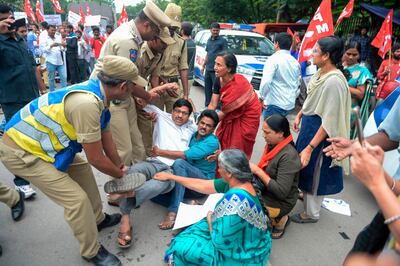 Members of the Communist Party of India are detained by police at a protest in Hyderabad on August 7, 2019, in reaction to the Indian government scrapping Article 370 that granted a special status to Jammu and Kashmir. A protester died after being chased by police during a curfew in Kashmir's main city, left in turmoil by an Indian government move to tighten control over the restive region, a police official said August 7.
 / AFP / NOAH SEELAM
