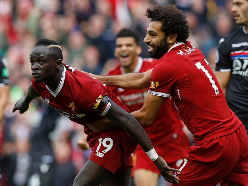 Liverpool's Sadio Mane celebrates scoring his side's first goal of the game during the Premier League match at Anfield, Liverpool. PRESS ASSOCIATION Photo. Picture date: Saturday August 19, 2017. See PA story SOCCER Liverpool. Photo credit should read: Martin Rickett/PA Wire. RESTRICTIONS: EDITORIAL USE ONLY No use with unauthorised audio, video, data, fixture lists, club/league logos or "live" services. Online in-match use limited to 75 images, no video emulation. No use in betting, games or single club/league/player publications.