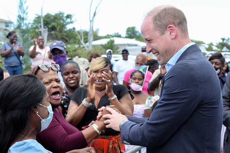 Britain's Prince William shakes hands with a member of the public in the Bahamas, although not everyone was pleased to see him. Getty