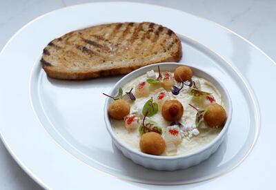 DUBAI, UNITED ARAB EMIRATES , Feb 20  – 2020 :- QG Smoked Haddock and Scottish Haggis Pate dish at the Queen’s Grill restaurant on the QE 2 in Dubai. (Pawan  Singh / The National) For Lifestyle. Story by Janice Rodrigues