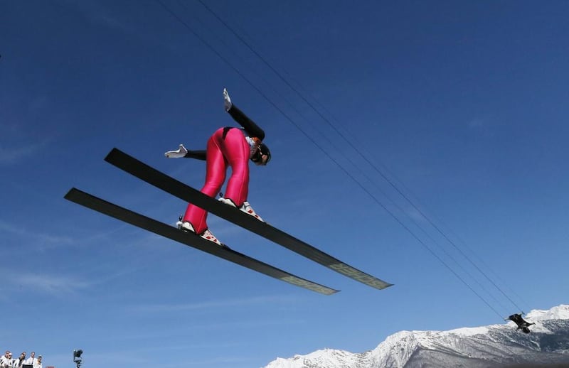 Germany's Johannes Rydzek makes his trial jump during the ski jumping portion of the nordic combined at the 2014 Winter Olympics on Wednesday. Dmitry Lovetsky / AP