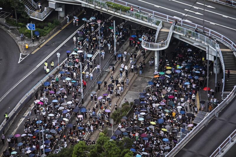 Demonstrators march along Queensway during a protest in the Central district of Hong Kong, China, on Sunday, Sept. 15, 2019. Tens of thousands of protesters marched through central Hong Kong, defying a police ban on a mass rally that had been planned for Sunday afternoon. Photographer: Justin Chin/Bloomberg