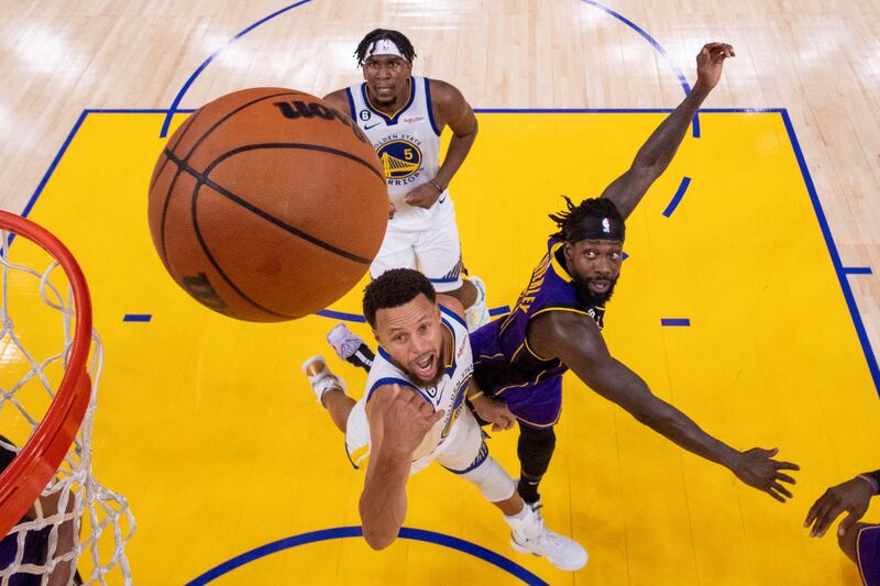 Golden State Warriors guard Stephen Curry shoots the basketball against Los Angeles Lakers guard Patrick Beverley during the second half at Chase Centre in San Francisco.  Reuters