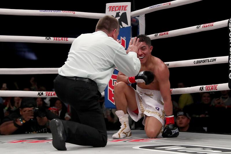 Jessie Vargas takes a count after going down in the fifth round. AFP