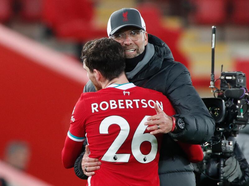 Jurgen Klopp and Andrew Robertson celebrate at the end of the match. Reuters
