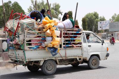 People displaced due to fighting between the Taliban and Afghan security forces flee an area in Kandahar, Afghanistan. EPA 