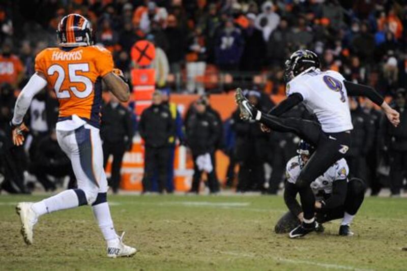 Justin Tucker kicks the winning field goal for Baltimore against the Denver Broncos.