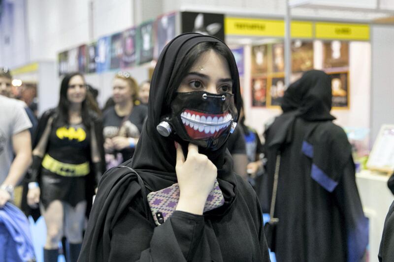 DUBAI, UNITED ARAB EMIRATES - APRIL 7, 2018. 
A girl with a mouth mask at Middle East Film and Comic Con.

(Photo by Reem Mohammed/The National)

Reporter:
Section: NA