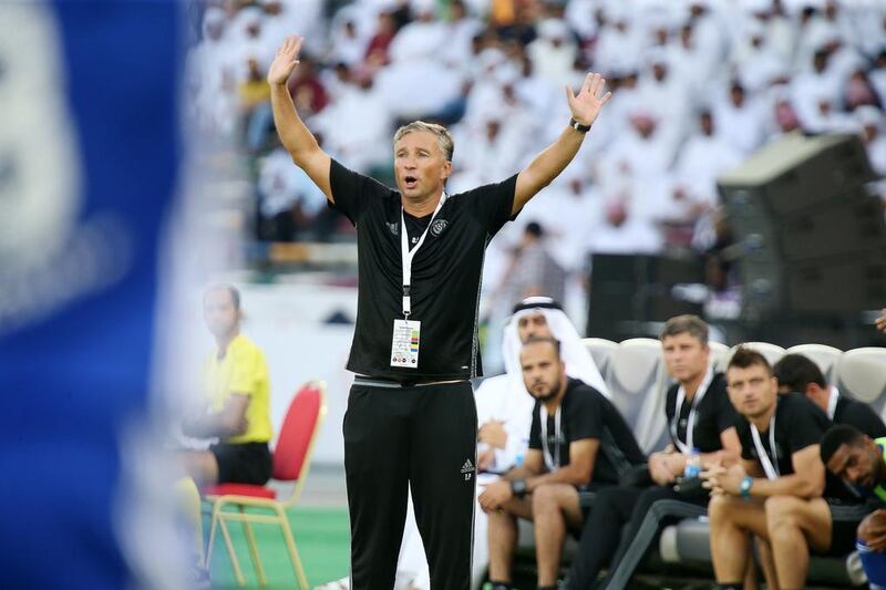 Al Nasr manager Dan Petrescu gestures from the touchline.
