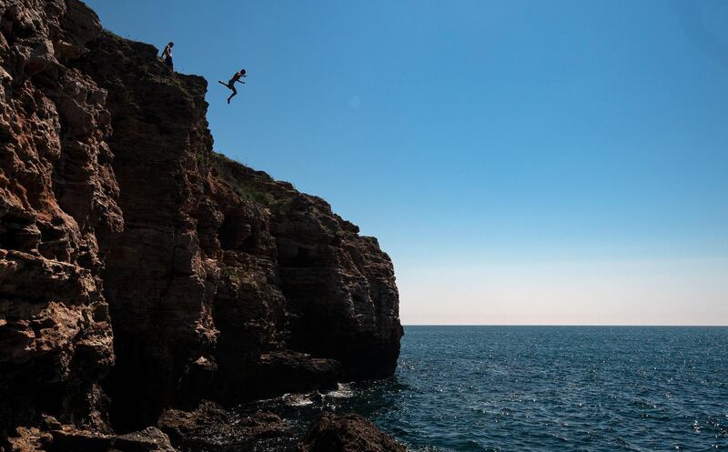 A young boy jumps into the Black Sea near the village of Tyulenovo, Bulgaria.  EPA