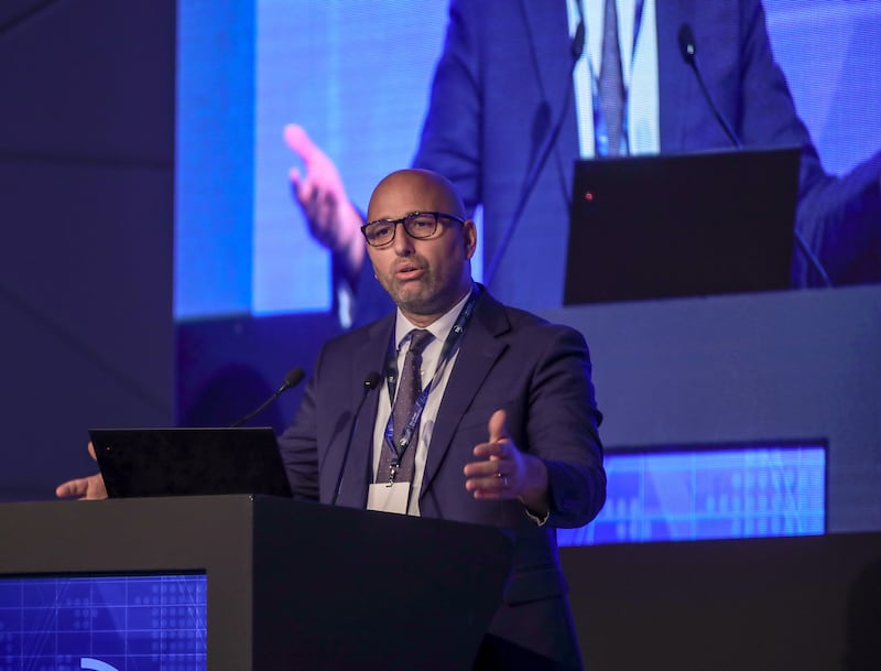 Technology Innovation Institute researcher Merouane Debbah addresses the inaugural Abu Dhabi 6G Summit on Thursday. Victor Besa / The National