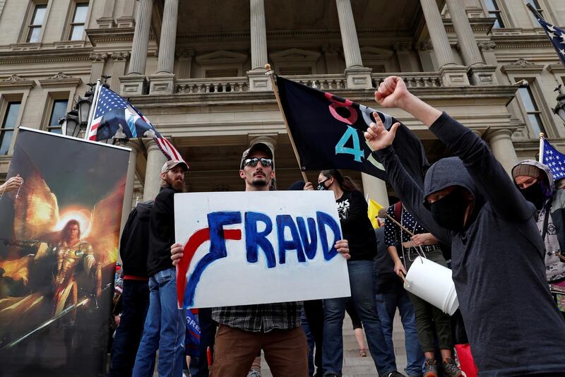 Supporters of US President Donald Trump rally outside the State Capitol building after Joe Biden was declared the winner of the 2020 presidential election, in Lansing, Michigan.  Reuters