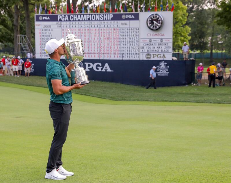 epa06947298 Brooks Koepka of the US poses with the Wanamaker Trophy after winning the 100th PGA Championship golf tournament at Bellerive Country Club in St. Louis, Missouri, USA, 12 August 2018.  EPA/ERIK S. LESSER