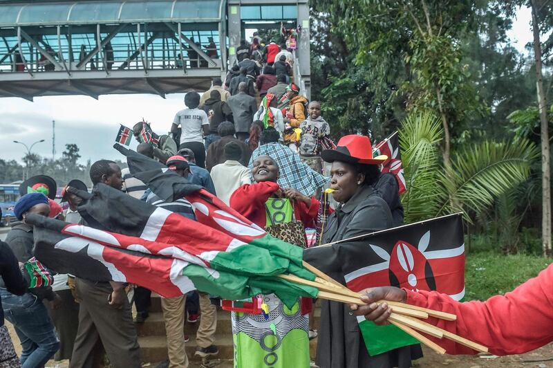 Hawkers and members of the public gather outside the Kasarani Stadium on November 28, 2017 to attend the inauguration ceremony of Kenyan president. Simon Maina / AFP