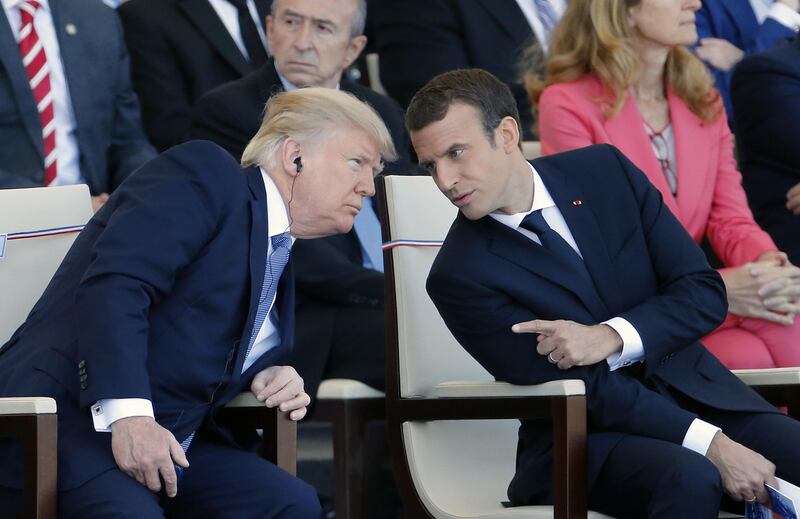 PARIS, FRANCE - JULY 14:  U.S President Donald Trump and French President Emmanuel Macron attend the traditional Bastille day military parade on the Champs-Elysees on July 14, 2017 in Paris France. Bastille Day, the French National day commemorates this year the 100th anniversary of the entry of the United States of America into World War I.  (Photo by Thierry Chesnot/Getty Images)