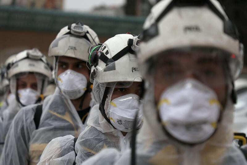 Members of the Syrian Civil Defence, also known as the 'White Helmets', sterilise a school in the area of Ghosn Al Zeitun in Afrin on March 18, 2020 as part of a campaign to disinfect schools against the coronavirus. AFP