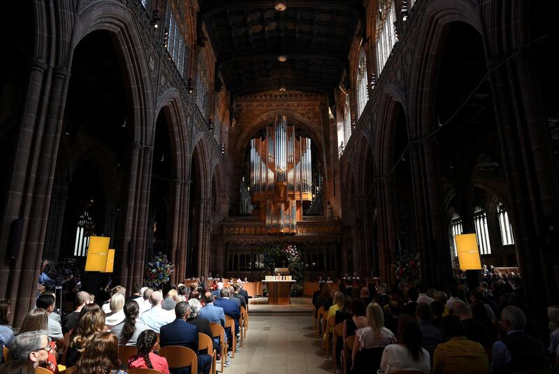 People attend the Manchester Arena National Service of Commemoration at Manchester Cathedral. Paul Ellis/Pool via Reuters