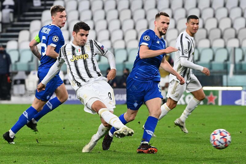 Juventus' forward Alvaro Morata scores their third goal. AFP