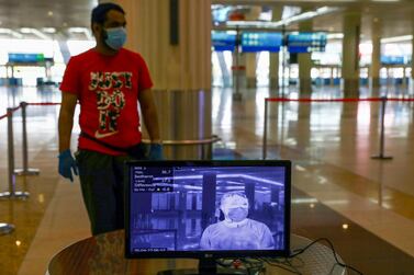 A man is seen through a thermal camera at Dubai International Airport, as Emirates airline resumed limited outbound passenger flights amid the outbreak of the coronavirus disease (COVID-19) in Dubai, UAE April 27, 2020. REUTERS/Ahmed Jadallah