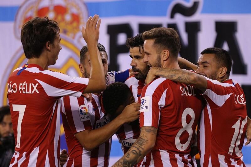 Diego Costa, centre, is congratulated on one of his four goals for Real. Reuters