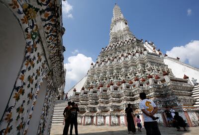 Visitors tour Wat Arun, also known as Temple of Dawn, in Bangkok, a day after Thailand restarted its 'Test & Go' programme. EPA