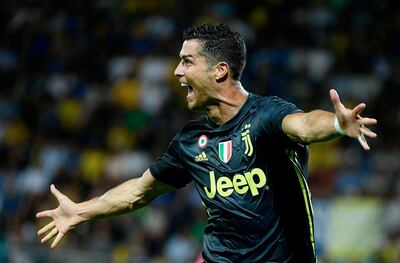 Juventus' Portuguese forward Cristiano Ronaldo celebrates after he scored during the Italian Serie A football match between Frosinone and Juventus Turin on September 23, 2018 at the Benito-Stirpe Stadium in Frosinone.  / AFP / Filippo MONTEFORTE
