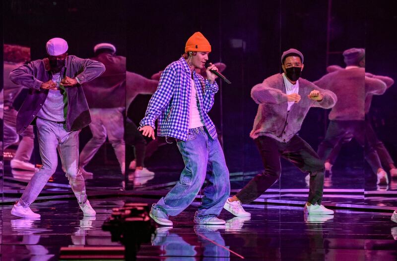 In this handout image courtesy of ABC singer Justin Bieber performs during the 2020 American Music Awards at the Microsoft theatre on November 22, 2020 in Los Angeles. (Photo by American Broadcasting Companies, Inc. / ABC / AFP) / RESTRICTED TO EDITORIAL USE - MANDATORY CREDIT "AFP PHOTO / Courtesy of ABC" - NO MARKETING - NO ADVERTISING CAMPAIGNS - DISTRIBUTED AS A SERVICE TO CLIENTS