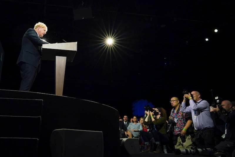 Mr Johnson delivers his leader's keynote speech during the Conservative Party conference at Manchester Central Convention Complex on October 6.