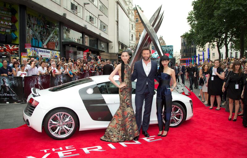 Actors, from left, Tao Okamoto, Hugh Jackman and Rila Fukushima arrive for the UK Premiere of The Wolverine, at a central London cinema in Leicester Square, Tuesday, July 16, 2013. (Photo by Joel Ryan/Invision/AP) *** Local Caption ***  Britain Premiere of The Wolverine- Outside Arrivals.JPEG-0c7bf.jpg