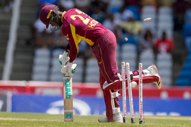 West Indies' Akeal Hosein is bowled by India seamer Arshdeep Singh during the first T20. AP