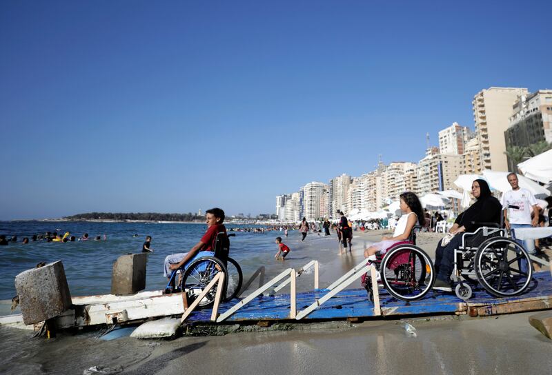 Wheelchairs users at the beach in Alexandria.