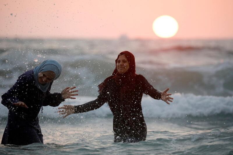 Women enjoy themselves along the shore of the Mediterranean Sea during Eid al-Fitr at a beach in Tel Aviv, Israel. Reuters