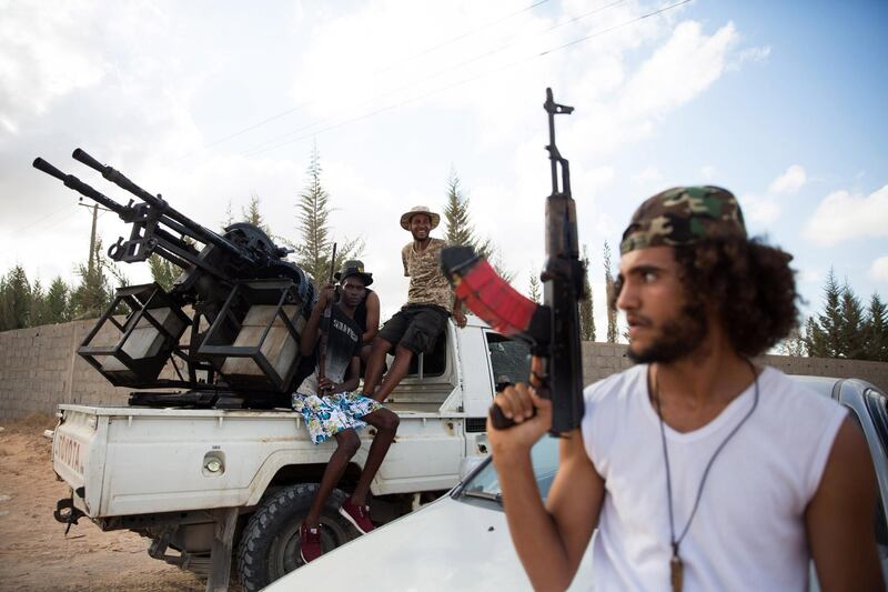 epaselect epa07047163 Libyan forces loyal to the Government of National Accord (GNA), Libya's internationally recognised government, guard from a position south of Tripoli, Libya, 25 Setember 2018. According to reports, Tripoli Security Directorate on 25 September 2018 announced end of fights on the outskirts of Tripoli after the withdrawal of the fighters of Misrata (east of Tripoli) and the strength of the fighters of Trahona (south-east of Tripoli).  EPA/STR