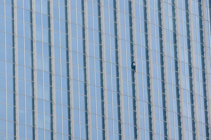 Alain Robert of France scales the exterior of the fifth tallest building in the world. Ed Jones / AFP