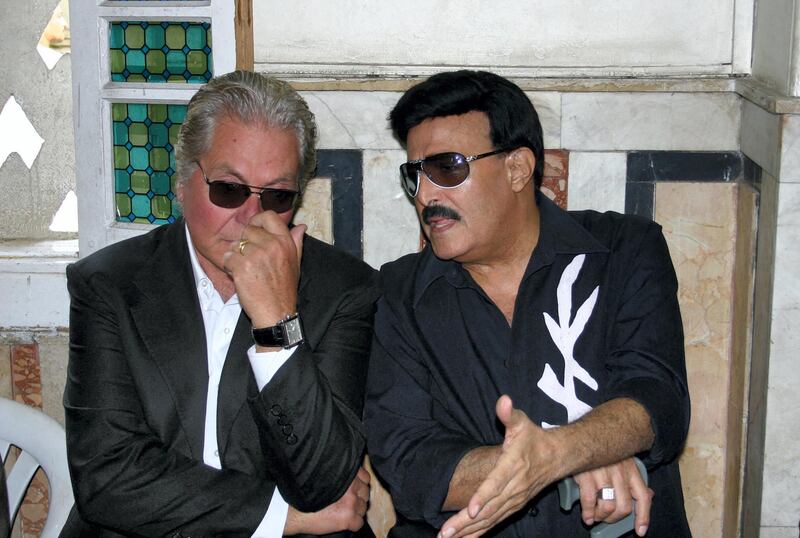 Egyptian film star Hussein Fahmi (L) and comedian Samir Ghanem attend a condolences ceremony after the funeral of fellow comedian Fuad al-Muhandes in Cairo 16 September 2006. Muhandes, 84, died today in the Egyptian capital, according to his family. Born in 1924 in the Cairo suburb of Abbasiya, Muhandes became one of Egypt's leading comdians both in theatre and film from the early 1950s up until he retired in the 1990s. AFP PHOTO/AMRO MARAGHI (Photo by AMRO MARAGHI / AFP)