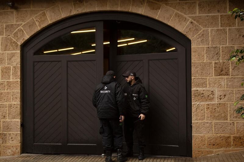 Security guards stand outside the Beirut home of Carlos Ghosn days after he arrived in the country having fled from Japan. AP