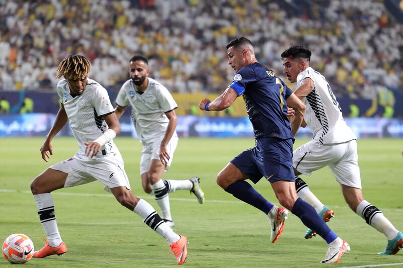 Cristiano Ronaldo takes on Al Shabab defender Fawaz al-Sqoor. AFP