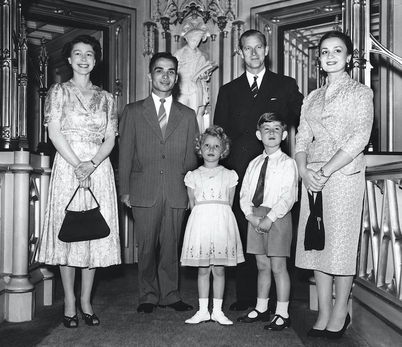 King Hussein of Jordan (2nd L) ans his wife Queen Dina (R) on honey moon in Great-Britain pose together with Britain's Queen Elizabeth II (L), Britain's Prince Philip, Duke of Edinburgh (2nd R), Britain's Prince Charles, Prince of Wales and 's Princess Anne, Princess Royal, on June 19, 1955 at Windsor Castle. (Photo by - / AFP)