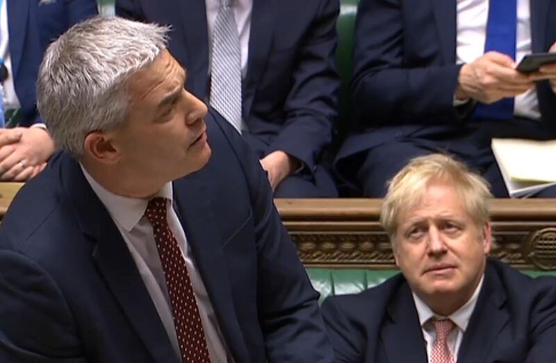 A video grab from footage broadcast by the UK Parliament's Parliamentary Recording Unit (PRU) shows Britain's Prime Minister Boris Johnson (R) reacting as Britain's Secretary of State for Exiting the European Union (Brexit Minister) Stephen Barclay speaking during the conclusion of proceedings of the European Union (Withdrawal Agreement) Bill, in the House of Commons in London on January 9, 2020.  - RESTRICTED TO EDITORIAL USE - NO USE FOR ENTERTAINMENT, SATIRICAL, ADVERTISING PURPOSES - MANDATORY CREDIT " AFP PHOTO / PRU "
 / AFP / PRU / HO / RESTRICTED TO EDITORIAL USE - NO USE FOR ENTERTAINMENT, SATIRICAL, ADVERTISING PURPOSES - MANDATORY CREDIT " AFP PHOTO / PRU "
