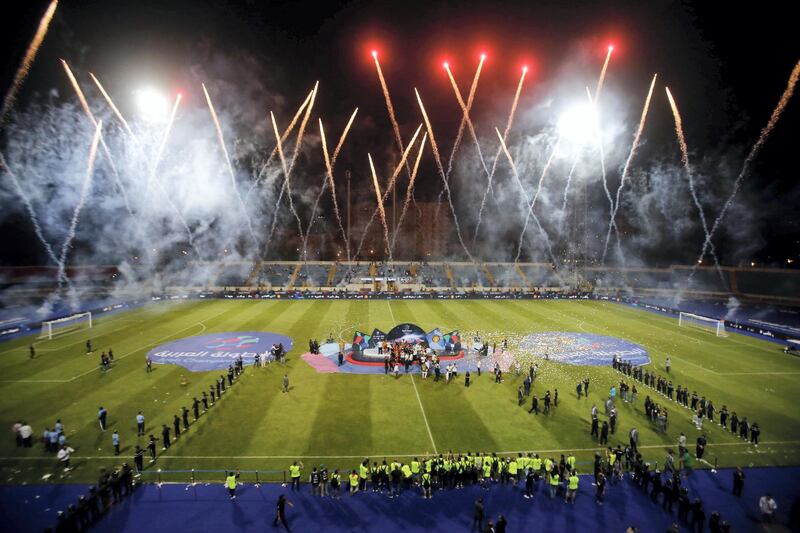 Fireworks during the Tunis’s Esperance players receiving the trophy for their victory over Jordan’s  Al-Faisaly in the final match in Arab Club championship at Alexandria Stadium on August 6, 2017, Tunis’s Esperance team won 3-2.
  / AFP PHOTO / AHMED ABD EL-GAWAD