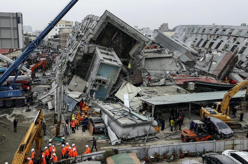 Rescuers search for survivors from a collapsed building following a 6.4 magnitude earthquake that struck the area in Tainan, Taiwan. More than 100 people remained missing in the building’s rubble. Ritchie B Tongo / EPA