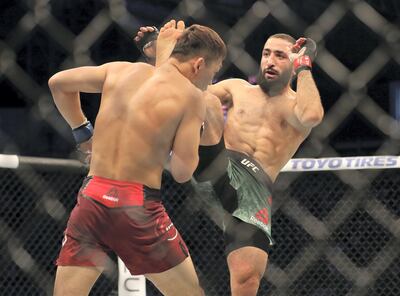Abu Dhabi, United Arab Emirates - September 07, 2019: Welterweight bout between Belal Muhammad (green shorts, winner) and Takashi Satō in the Early Prelims at UFC 242. Saturday the 7th of September 2019. Yas Island, Abu Dhabi. Chris Whiteoak / The National