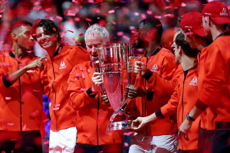 John McEnroe, captain of Team World, celebrates with the Laver Cup. Getty