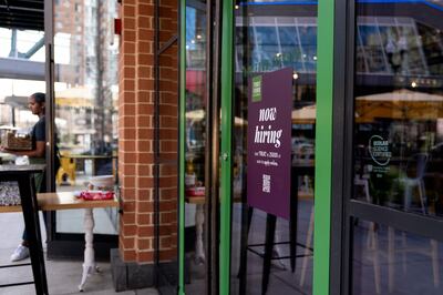 A “Now Hiring” sign is displayed at a restaurant in Arlington, Virginia, on March 16, 2022.  AFP