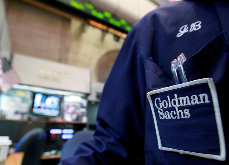 FILE PHOTO:  A trader works at the Goldman Sachs stall on the floor of the New York Stock Exchange, New York, U.S. on April 16, 2012.  REUTERS/Brendan McDermid/File Photo